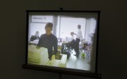 Still from Pilvi Takala's 'The Trainee', in which she worked at Deloitte for a month and provoked coworkers by seeming to do nothing. Still from Pilvi Takala's 'The Trainee', in which she worked at Deloitte for a month and provoked coworkers by seeming to do nothing.